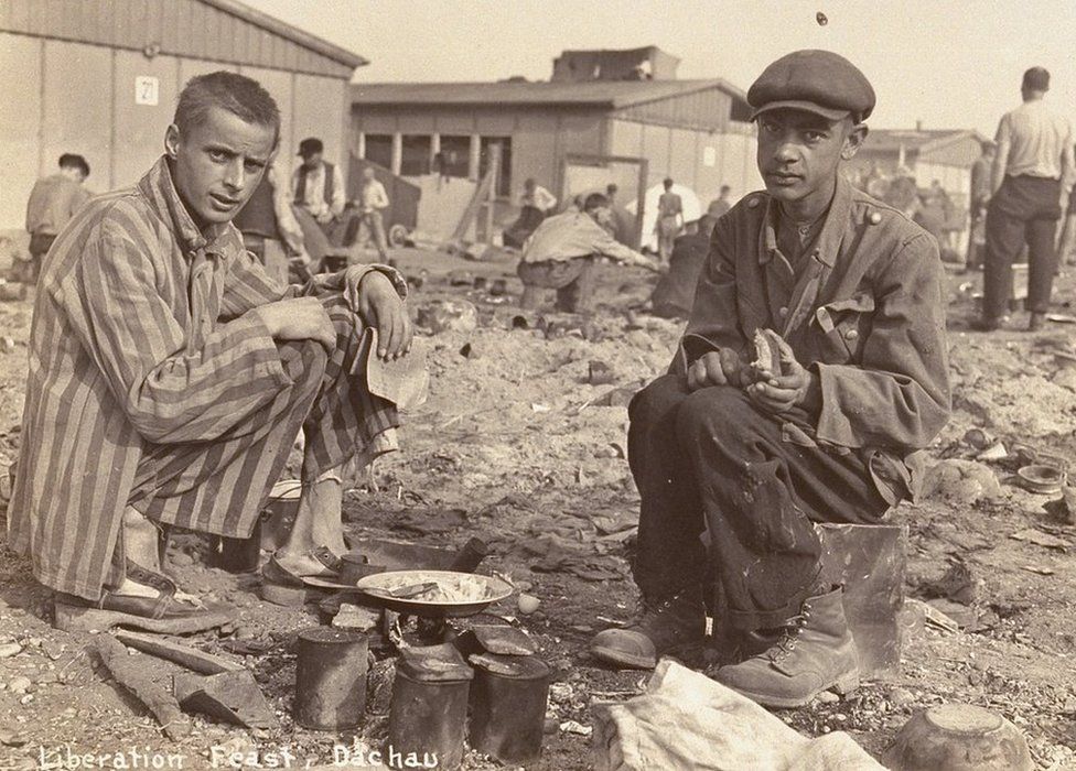 The man on the right in this picture from the Dachau concentration camp is thought to be Jean Voste, born in Congo, who was the only black prisoner in the camp. Courtesy of Frank Manucci.