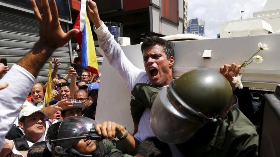 Leopoldo Lopez gets into a National Guard armoured vehicle in Caracas. Photo: February 2014