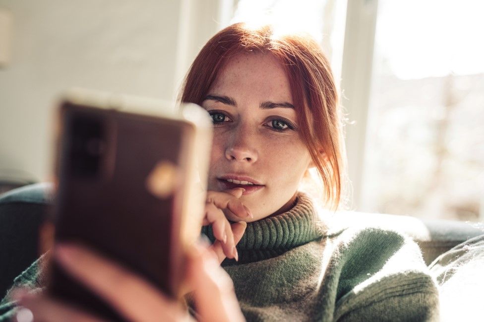 Woman using smartphone (stock image)