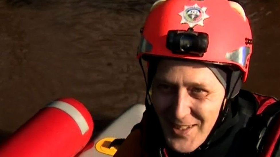 Storm Dennis: The biscuits and boats helping flood-hit villagers - BBC News