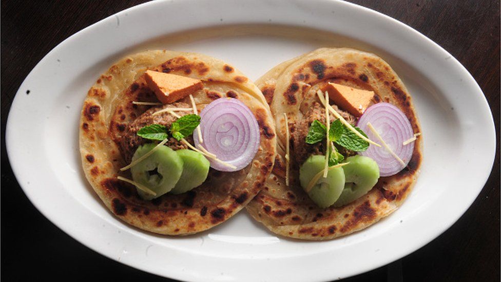 : Picture showing special Lucknowi Bengali dish named, Ghutwan Kabab with Paratha served with ginger juliennes cucumber onion and smoked bandel Cheese, at Ta'aam Restaurant on February 20, 2015 in Kolkata, India. (