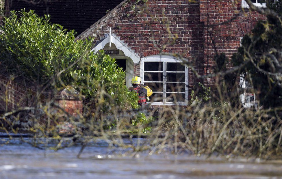 Fire and rescue personnel visit flooded properties in Bewdley