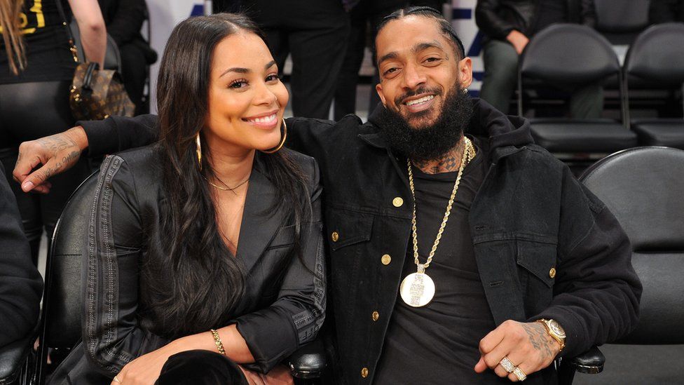 Nipsey Hussle and Lauren London at an NBA game