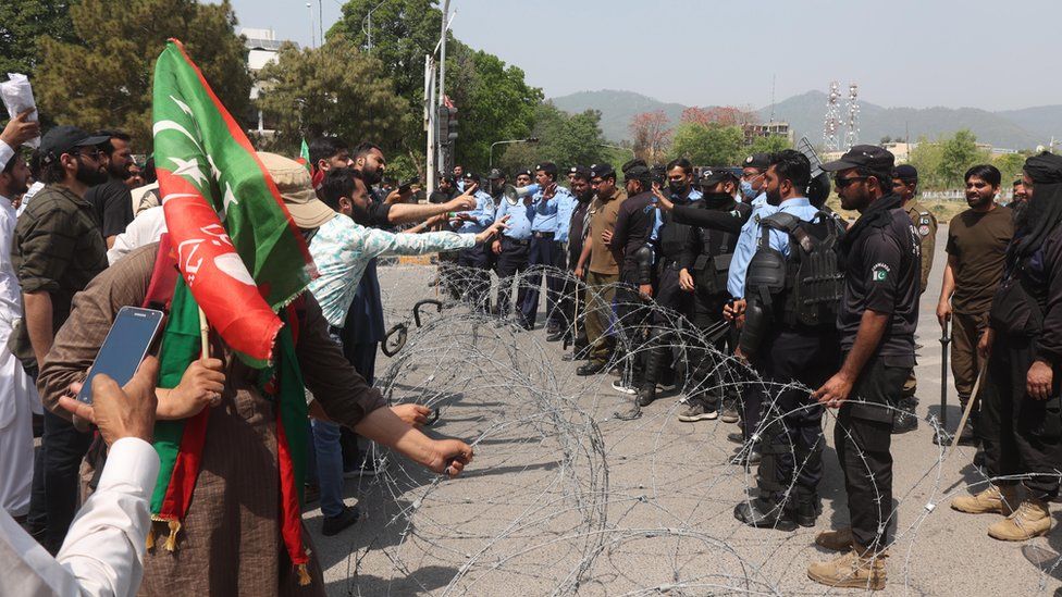 Supporters of incumbent ruling party Pakistan Tehrik-e-Insaf gather to support the Prime Minister Imran Khan's decision to dissolve parliament, 3 April 2022