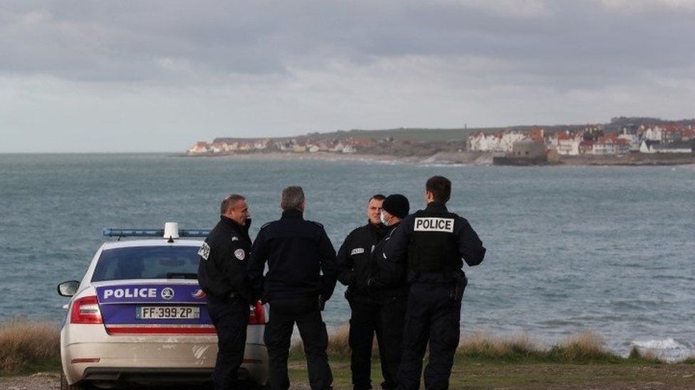 French police patrol beach at Wimereux