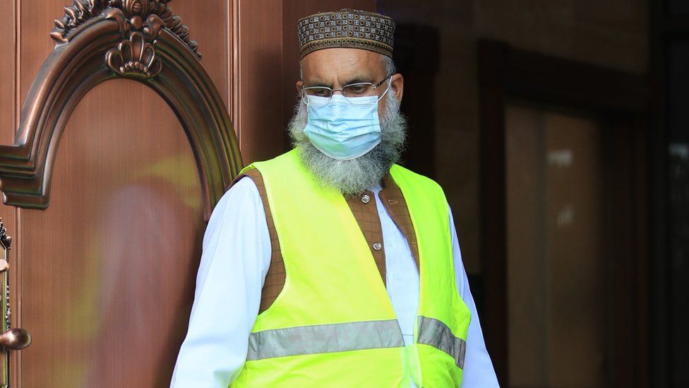 A worshipper in PPE at the Bradford Grand Mosque in Bradford, West Yorkshire