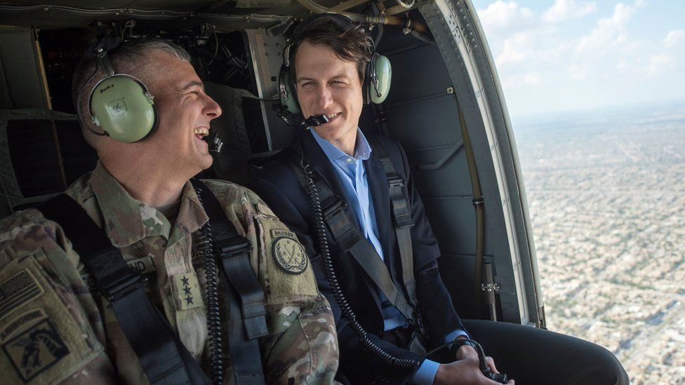 Jared Kushner (R) is pictured during a helicopter ride over Baghdad, Iraq