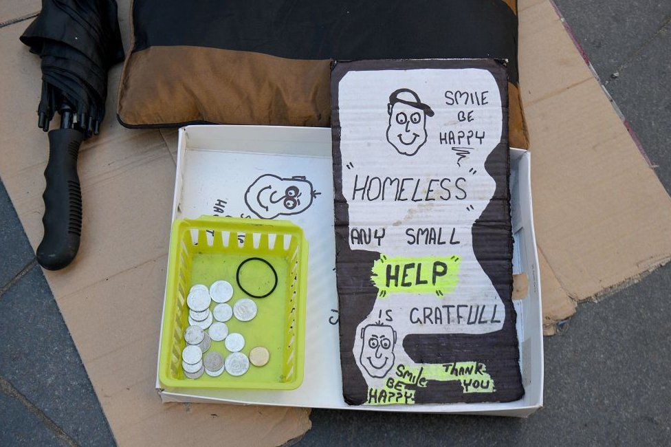 A homeless person's sign, asking for help
