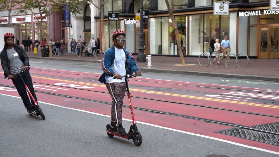 Man riding electric scooter in San Francisco