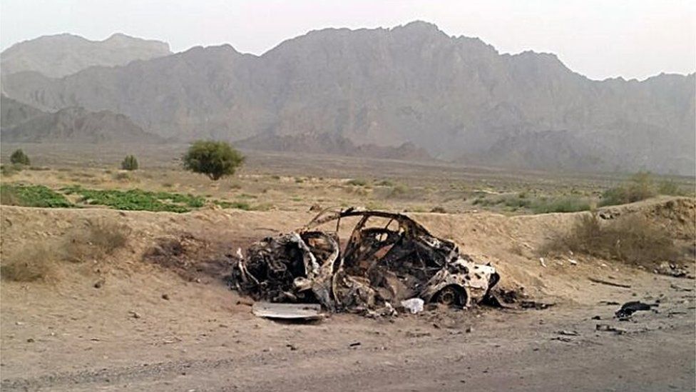 This photo taken by a freelance photographer Abdul Salam Khan using his smart phone on Sunday, May 22, 2016, purports to show the destroyed vehicle in which Mullah Mohammad Akhtar Mansour was traveling in the Ahmad Wal area in Baluchistan province of Pakistan, near Afghanistan"s border