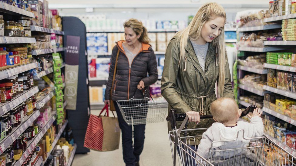 A mother with her baby shopping