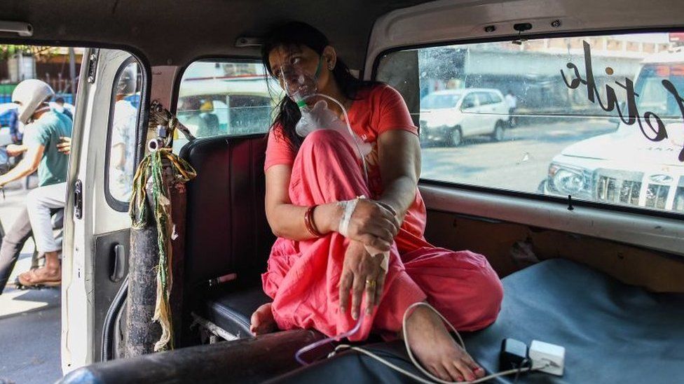 A Covid-19 patient on oxygen support waiting for admission amid a shortage of beds, at LNJP Hospital, on April 22, 2021 in New Delhi,