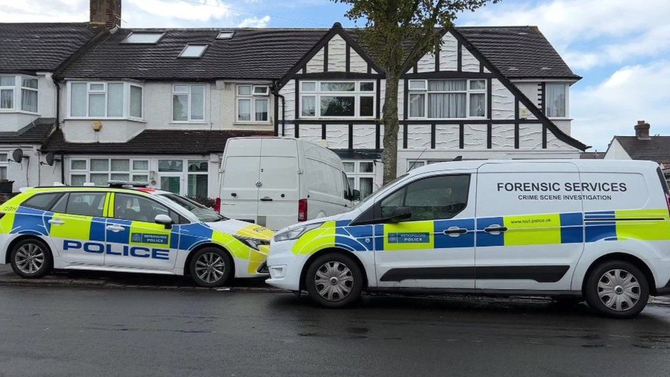 Police vans outside house