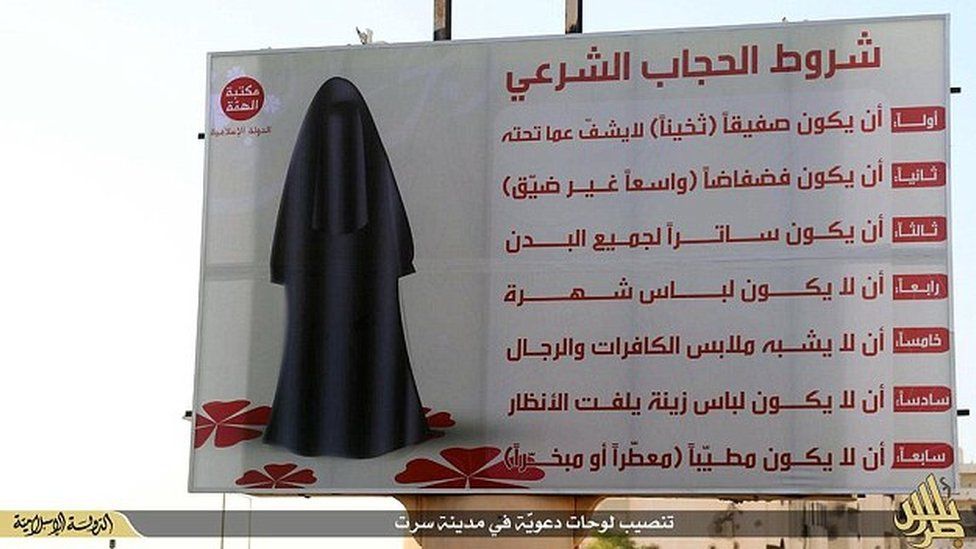 Image published by IS that the group says shows a billboard instructing women how to dress in Sirte