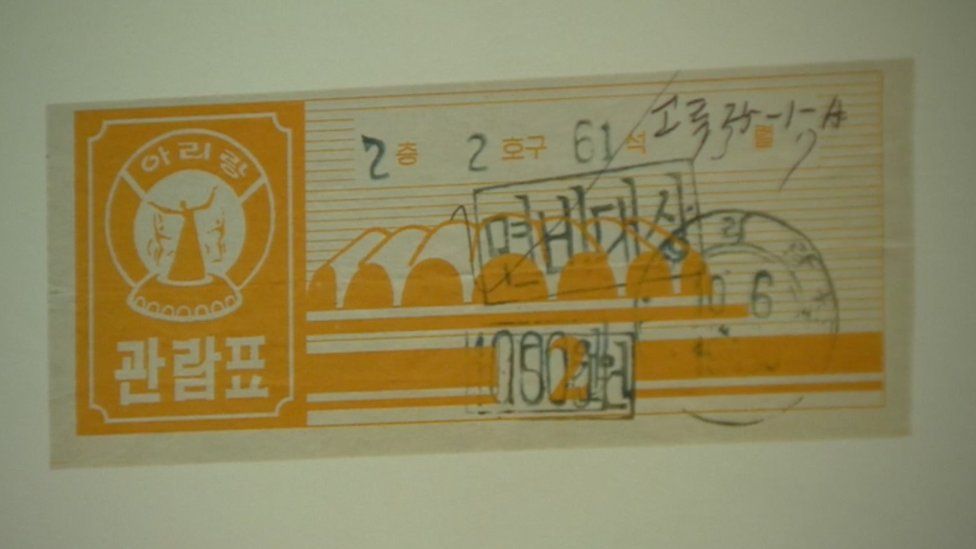 Ticket for Korean traditional performance ‘Arirang’. Seat and row numbers are handwritten. ‘Free’ is stamped on the centre.