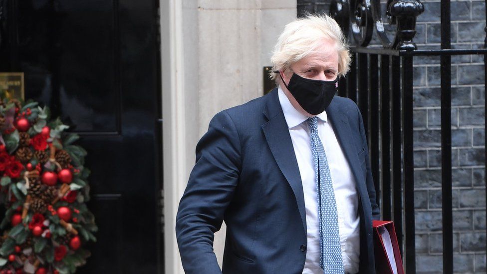 Boris Johnson wears a mask at Downing Street this week