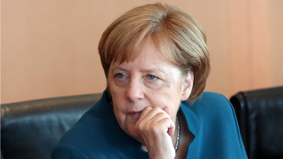 German Chancellor Angela Merkel looks on at the beginning of the weekly meeting of the German cabinet