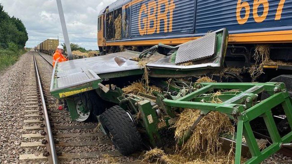 A tractor and freight train collided on a level crossing.