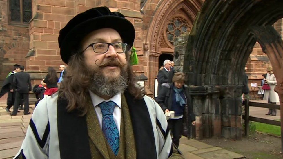 Dave Myers, wearing his cap and gown, at Cumbria Cathedral