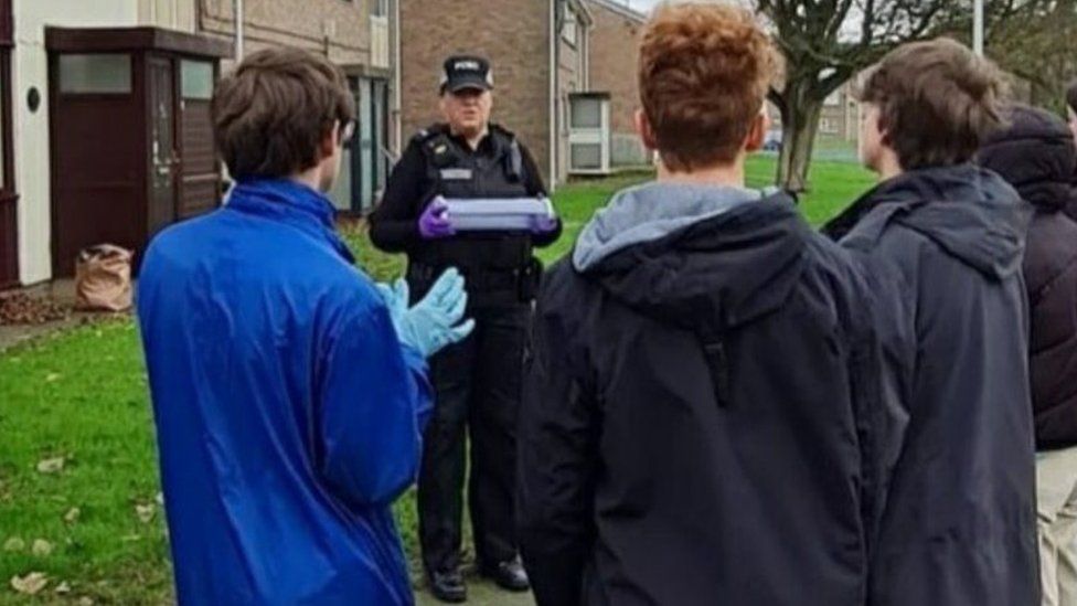 Police officer speaking to children about knife crime