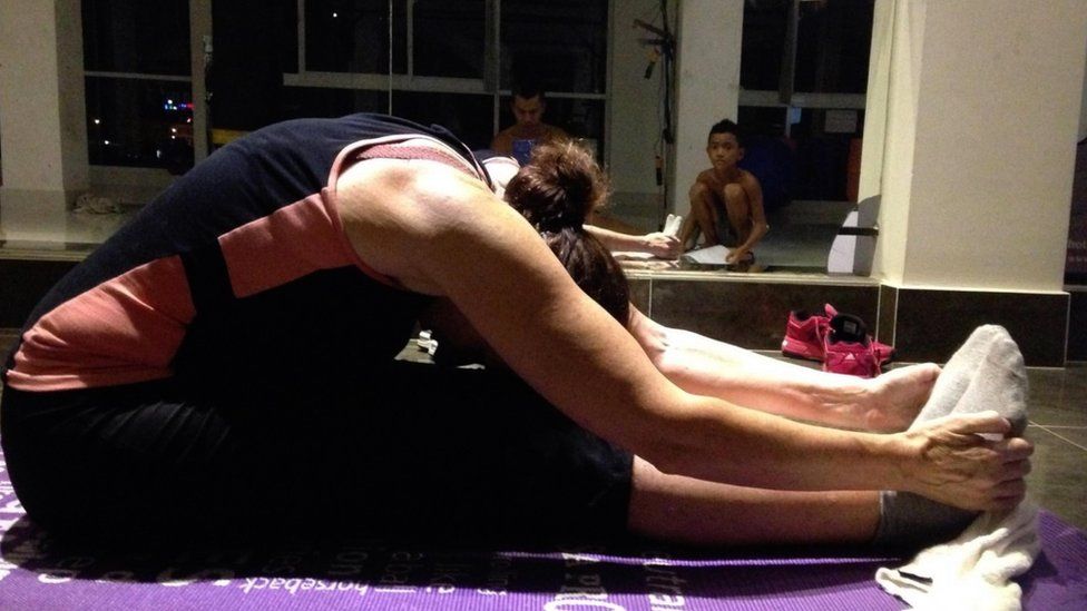 Cathy Trueman practicing yoga