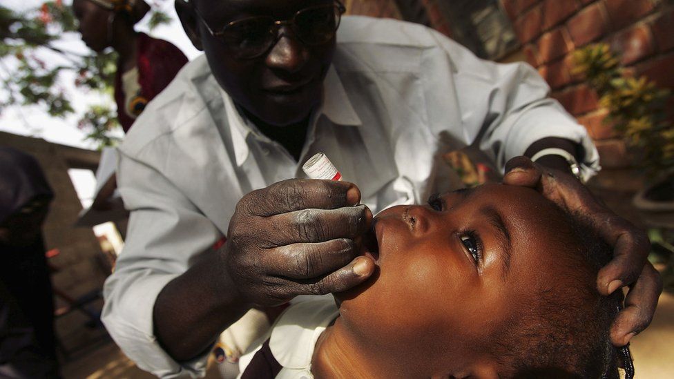 Boy being vaccinated against polio