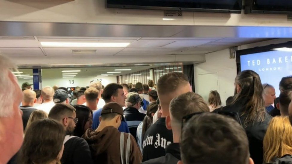 Fans queuing at Euston