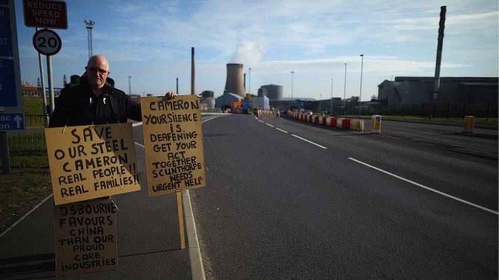 Lone demonstrator Neil Dawson protests in support of the UK steel industry outside the Tata Steel processing plant at Scunthorpe,