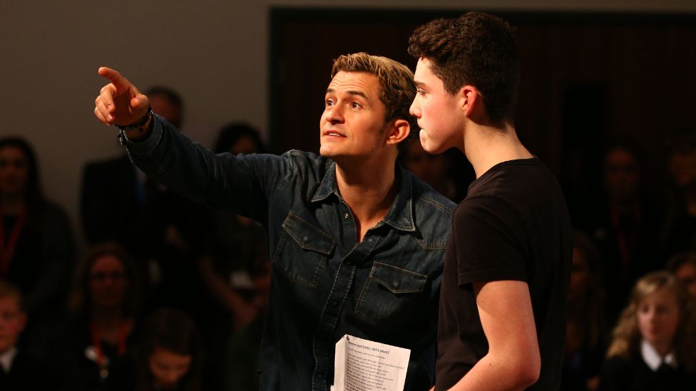 Orlando Bloom with a student at Cheadle Hulme High School