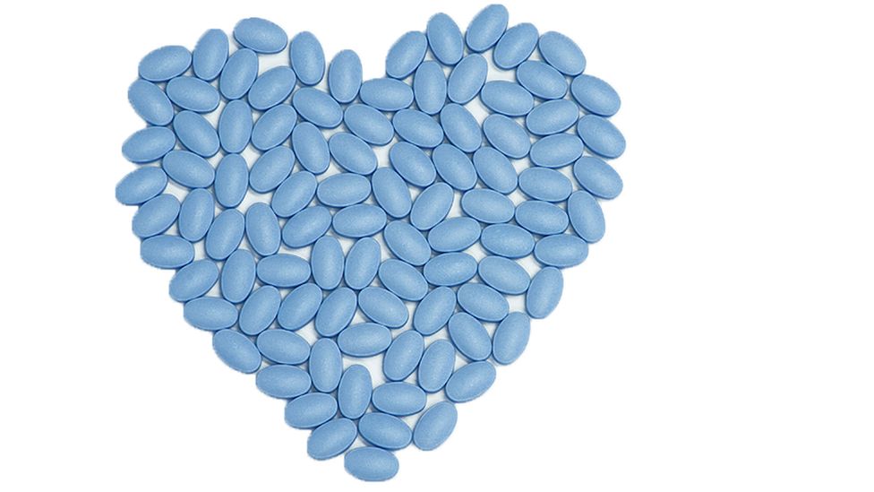 Heart shape made of little blue pills