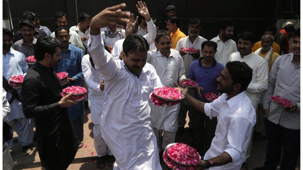 Supporters of Pakistan People's Party celebrate as Ali Haider Gilani, son of Former Pakistani Prime Minister and leader of opposition party Pakistan People's Party, Yousaf Raza Gilani, arrives at his house in Lahore, Pakistan, 11 May 2016.