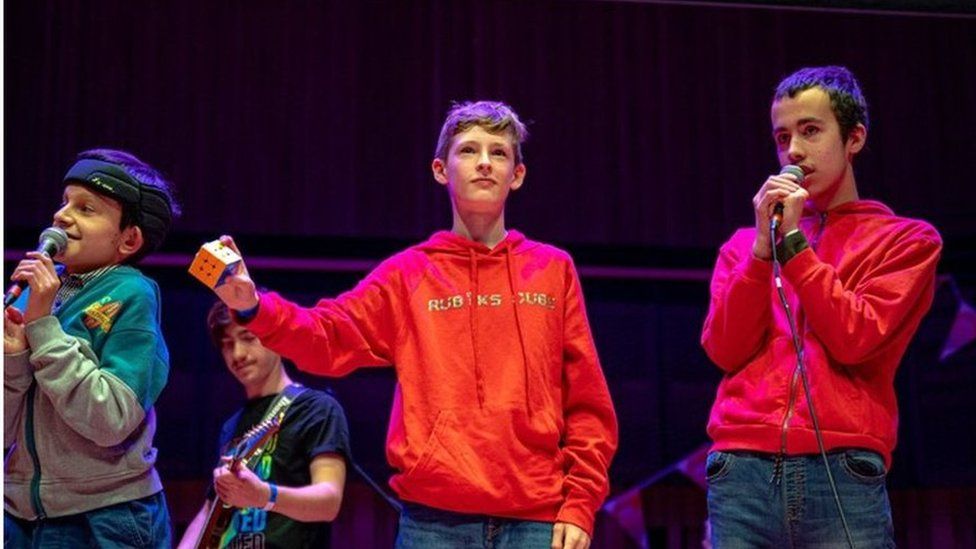 The youth rock group Rubik's Cube performing on stage
