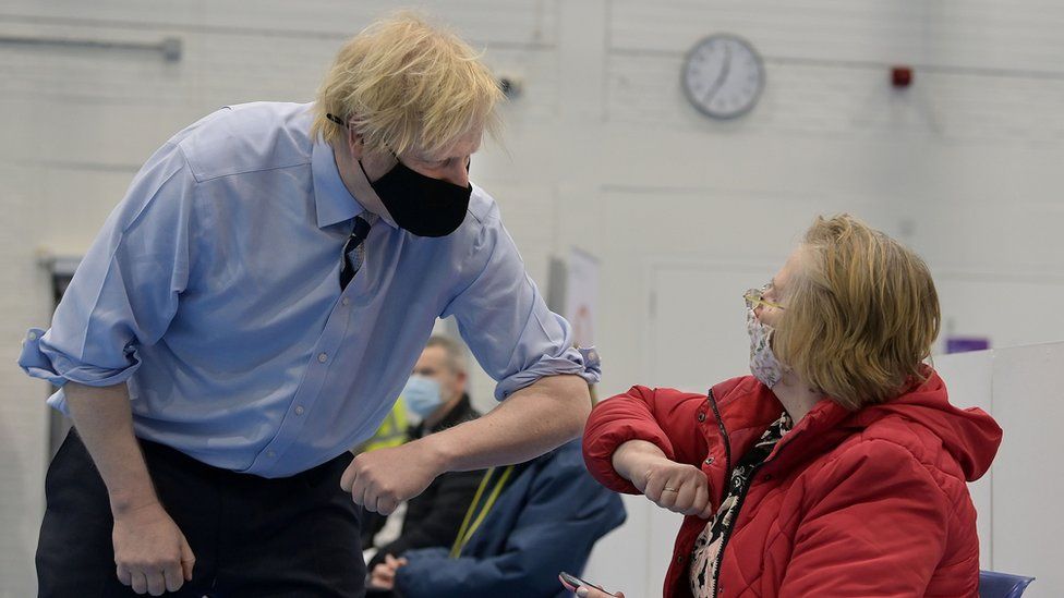 Boris Johnson meeting someone at vaccination centre