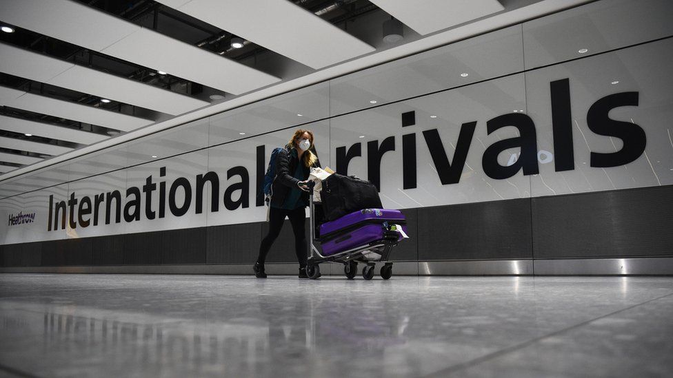 Woman arriving at Heathrow terminal 5