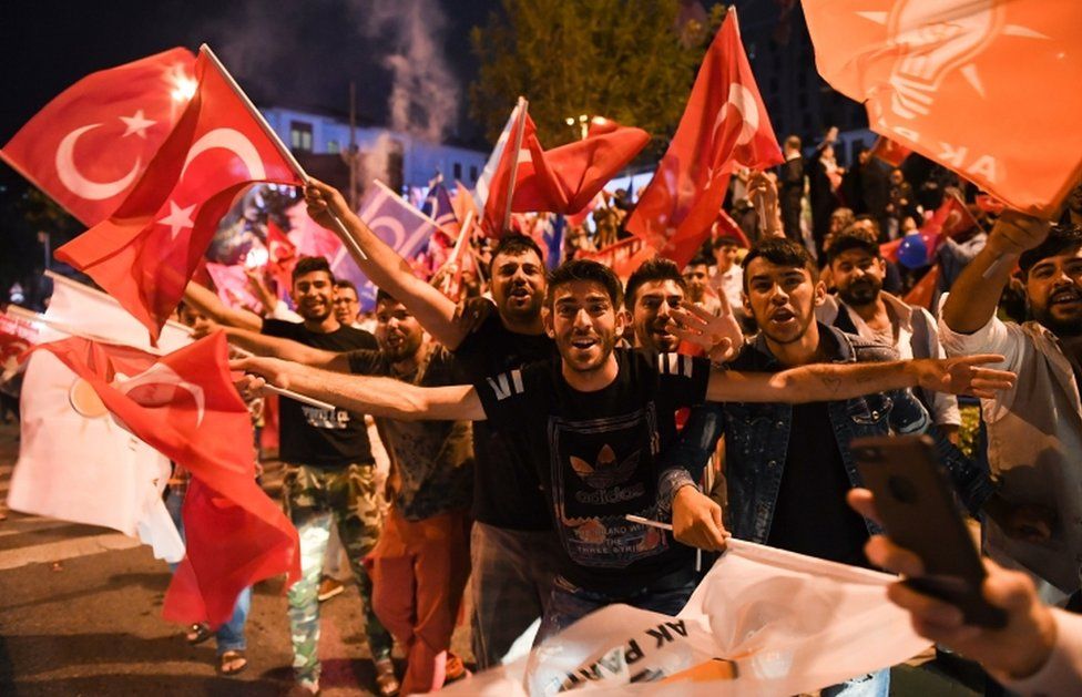 Erdogan supporters celebrate outside the AK party headquarters in Istanbul, Turkey