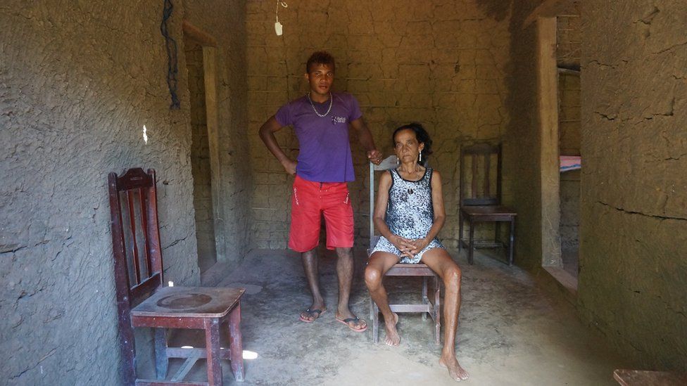 Dona Marina, whose husband was shot dead by gunmen, in their house in Vergel community