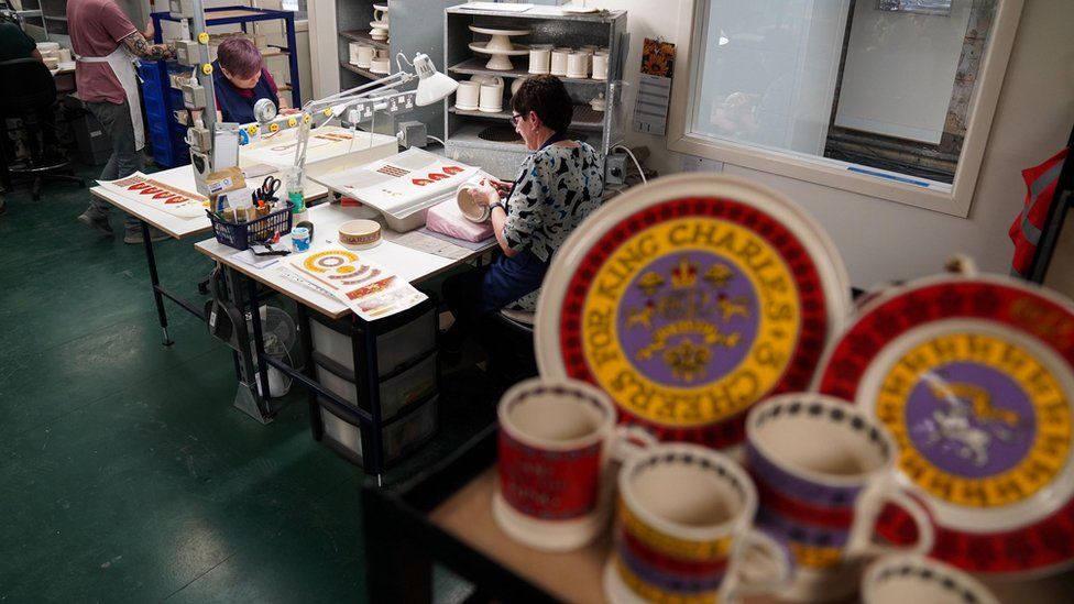 King Charles III themed mugs on display during the production of hand-decorated pieces from the forthcoming Coronation collection, at the Emma Bridgewater Pottery Factory in Stoke on Trent.