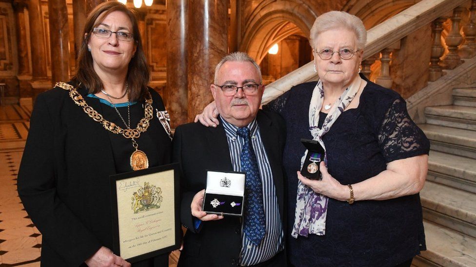 Lord Provost Eva Bolander presents the medal to Sapper Gahagan's family