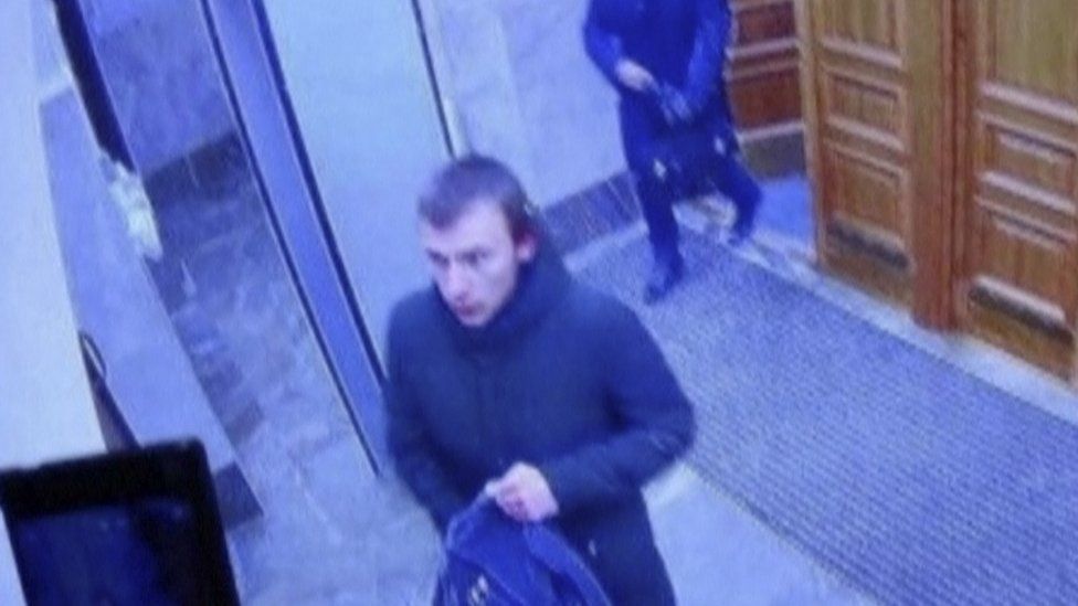 A CCTV image shows a teenager suspected of detonating a homemade bomb in the lobby of an office of the Russian Federal Security Service (FSB) in Arkhangelsk