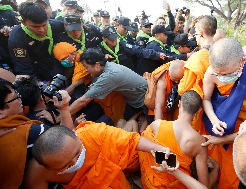 Thai Buddhist monks of Dhammakaya Temple and their supporters scuffle with police officers outside the temple in Pathum Thani province, on the outskirts of Bangkok, Thailand, 20 February 2017.