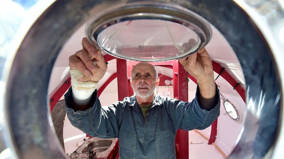 Jean-Jacques Savin works on the construction of the barrel-shaped vessel in November 2018