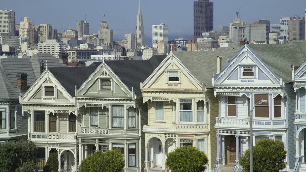 Painted Ladies in Alamo Square, Victorian-style houses in the residential area of San Francisco with downtown in the background,