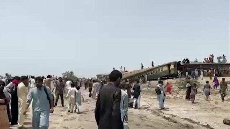 Dozens of radical   astatine  the country   of the accident. Passengers tin  beryllium  seen climbing retired  of derailed bid     coaches.