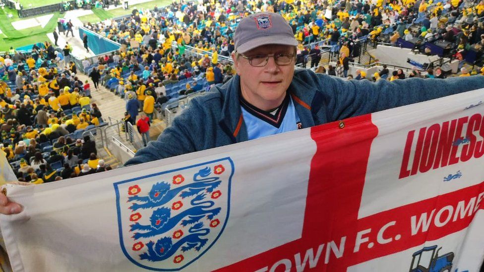 Ian Wallis holding an England flag