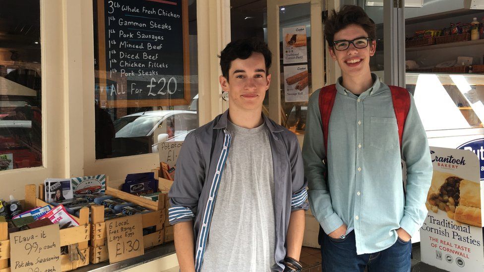 Will and Ethan outside a shop
