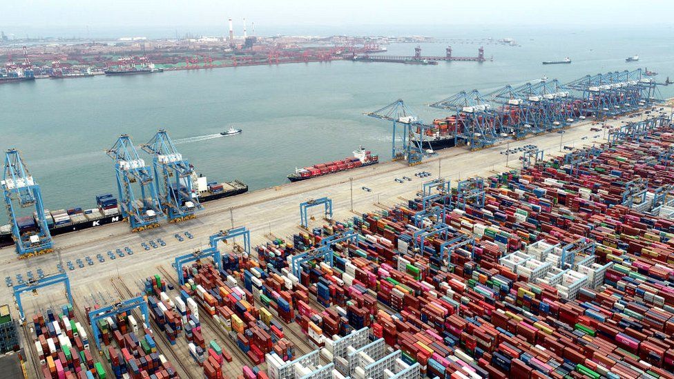 Cargo ships work at the Qianwan Container Terminal of Qingdao Port in East China's Shandong Province, April 13, 2022