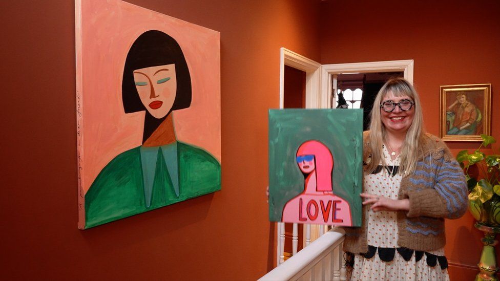 Marot in Margate fan Kara Louise Ziebart with two of her paintings