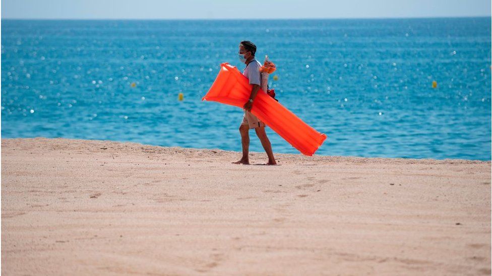 Man on beach in Spain