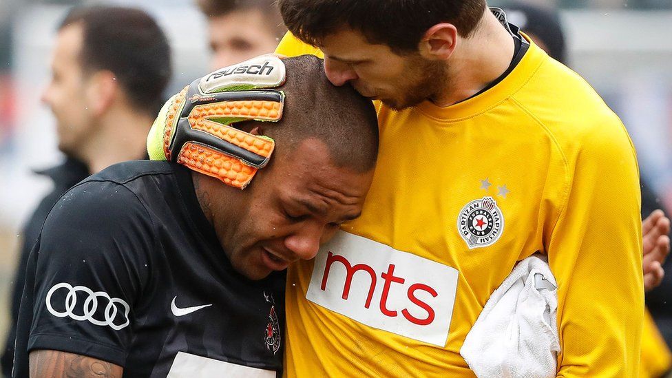 Partizan goalkeeper Filip Kljajic comforts Brazilian Everton Luiz who suffered racist abuse, 19 Feb 17