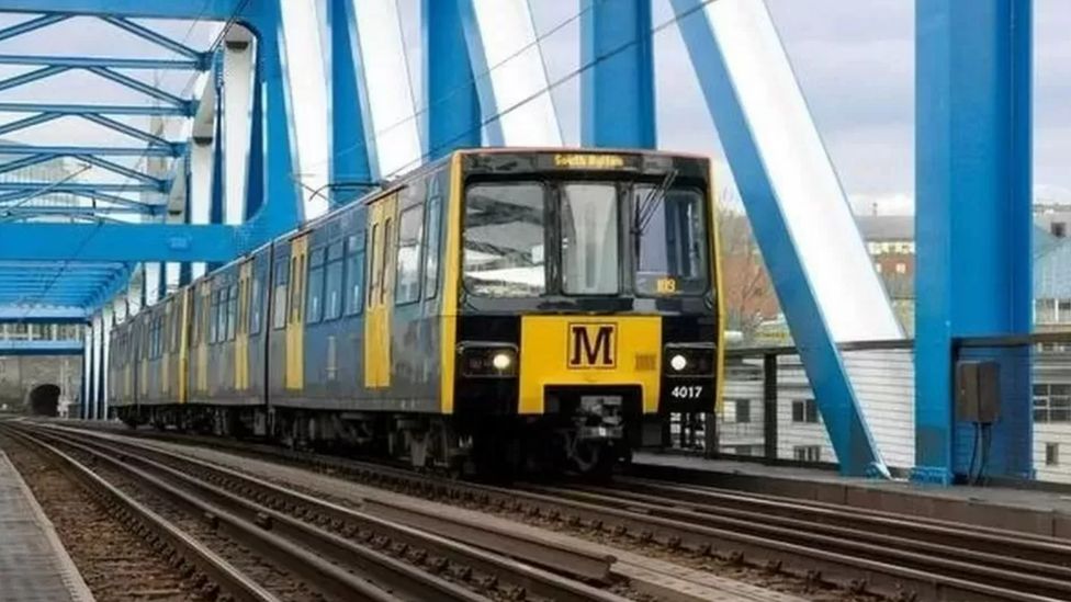 A Metro train passes into Newcastle